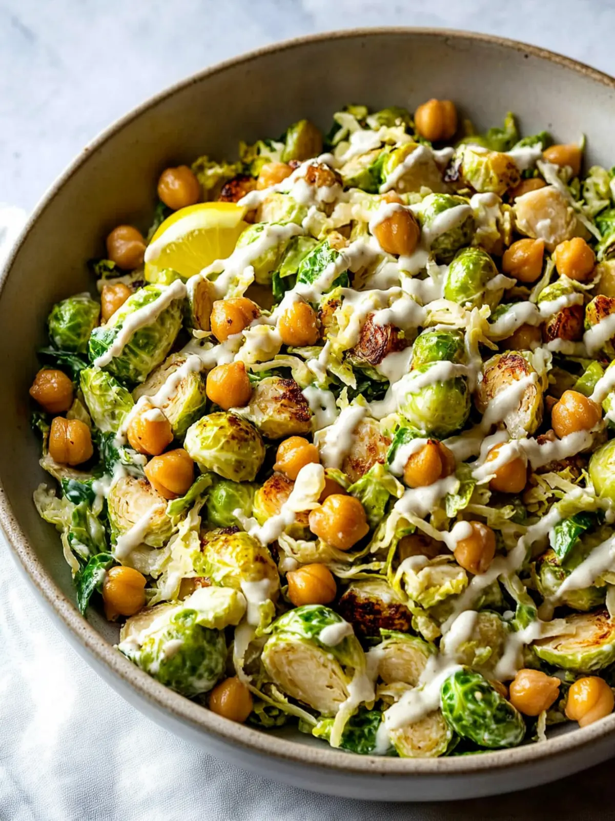 Shaved Brussels Sprouts Salad with Chickpeas and Lemon Tahini